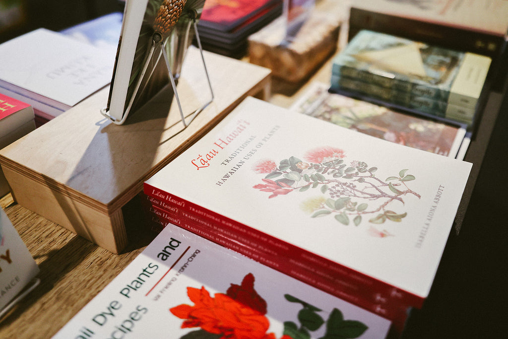 books on display with native plants