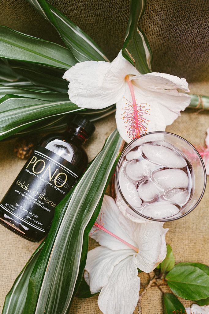 molokai hibiscus syrup with flower and drink glass