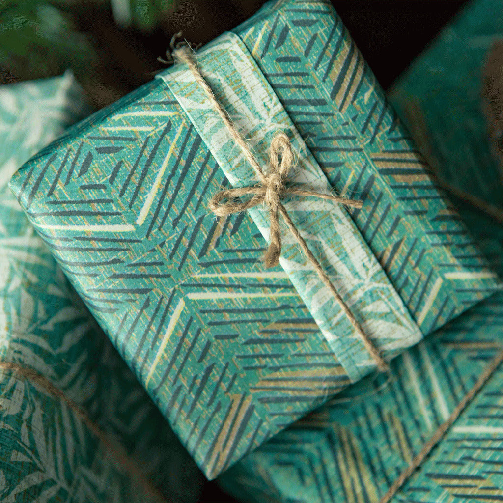 Na Mea Hawaiʻi - Noho Home - ʻAkahi & Lauaʻe Reversible Wrapping Paper - In Use